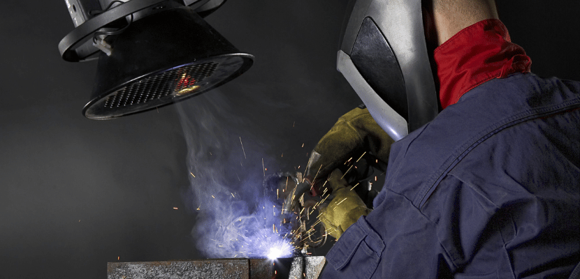 Welding fume suction equipment being used to eliminate harmful fume and smoke from the operator's breathing zone