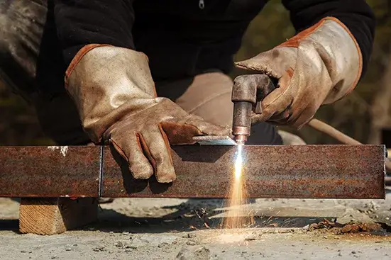 Plasma cutting for workpieces. Sparks during cutting of metal manual plasma cutting machine.